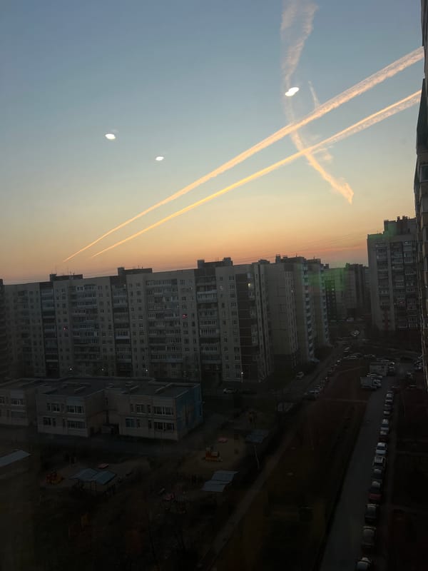 Apartment window views capture Saint Petersburg cityscape at dusk
