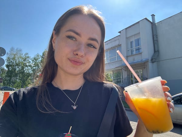 Woman enjoys morning treats and drinks during café visit