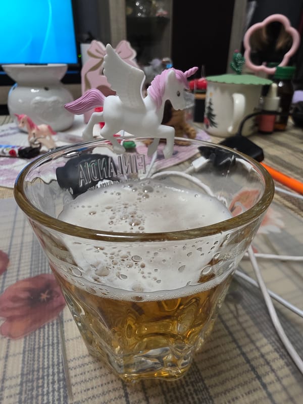 Beer and unicorn figurine photographed together in Bulgaria