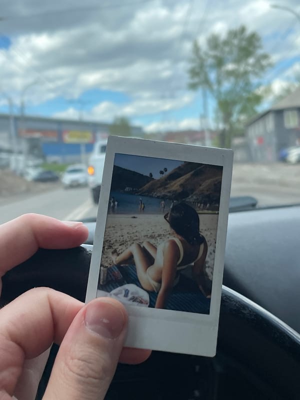 Beach Polaroid held inside car in Krasnoyarsk