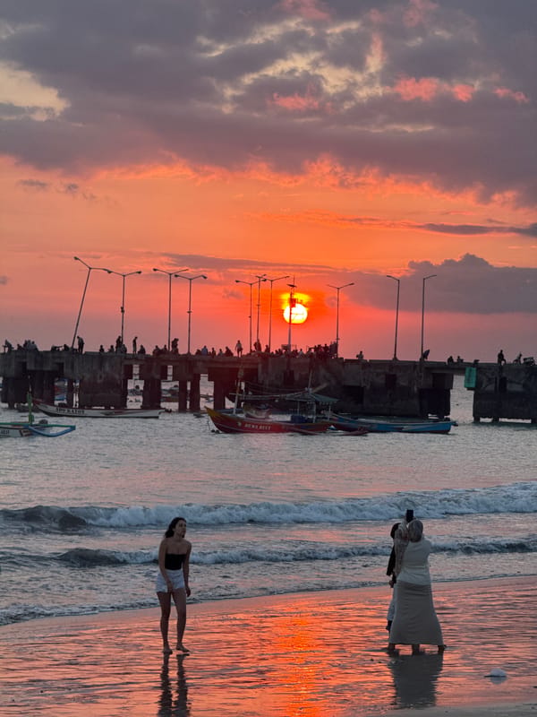 Sunset moments captured by beachgoers in Kuta, Indonesia