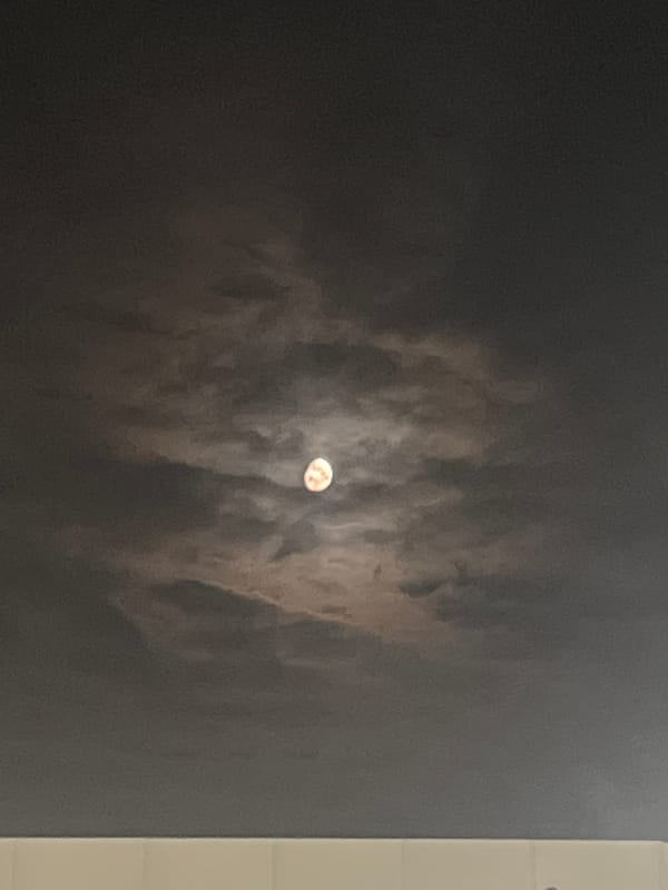Moon observation captured through clouds in Lupanovo, Russia