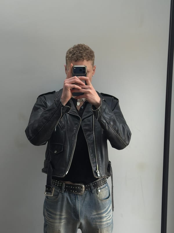 Person Takes Mirror Selfie in Black Leather Jacket, London