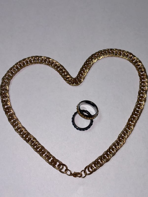 Jewelry collection laid out and styled across everyday surfaces