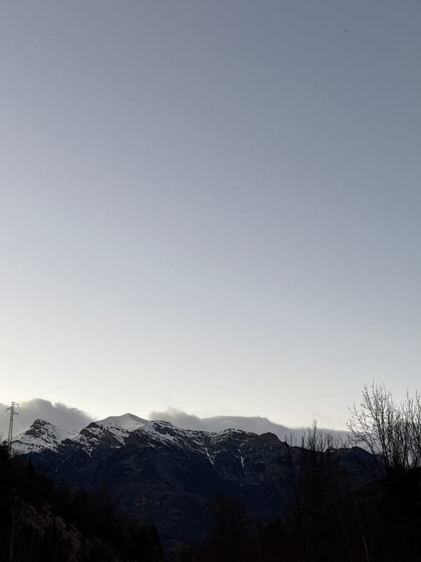 Snow-dusted mountains photographed in Chía, Spain