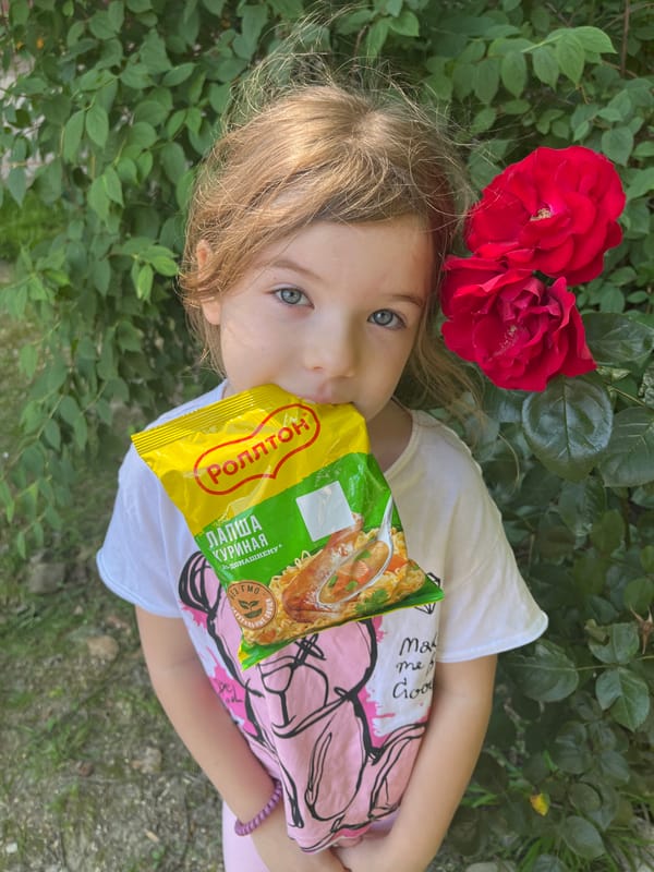 Child enjoys snacks, flowers during morning walk in Sochi