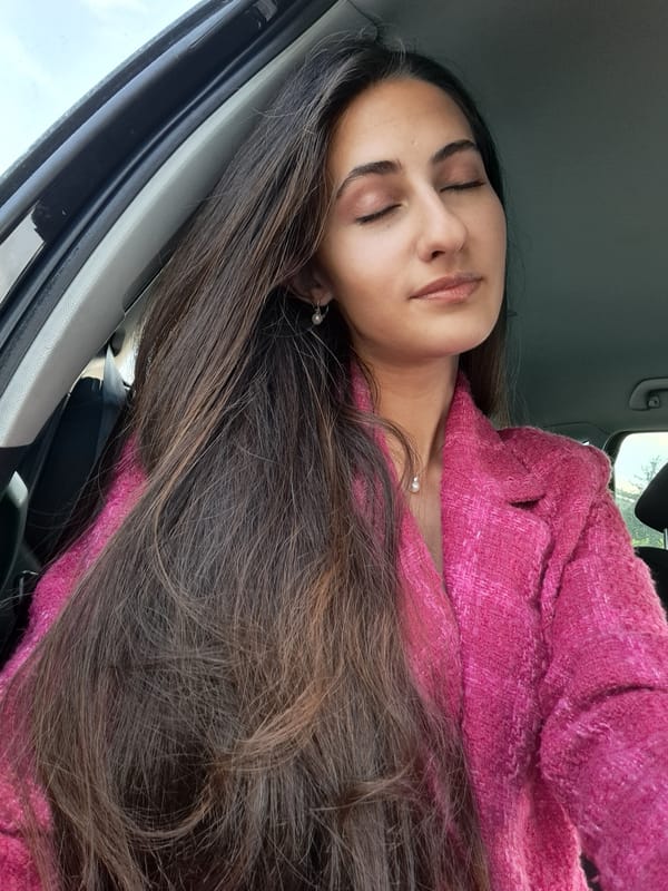 Woman rests peacefully inside car during early morning hours