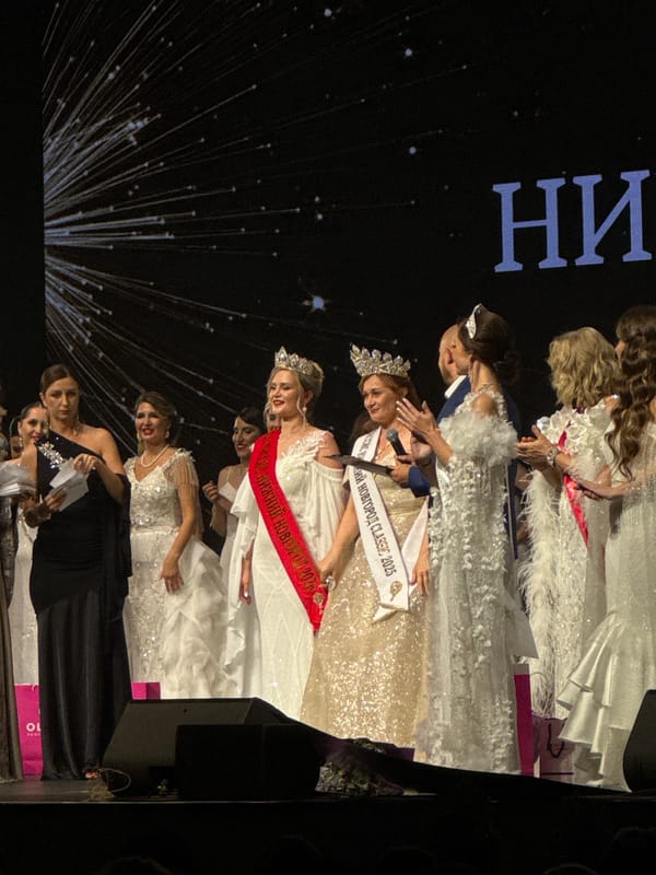 Beauty pageant contestants gather on stage for awards ceremony