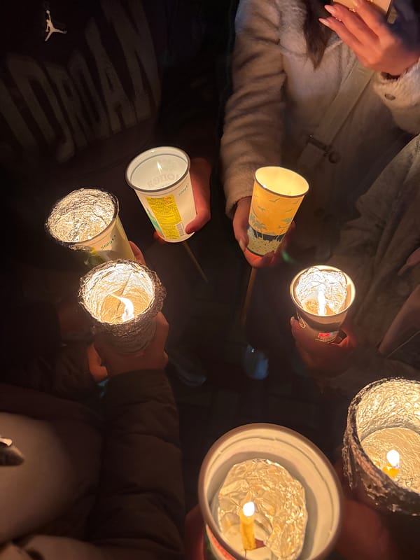 Candlelight vigil held with homemade candles in cups