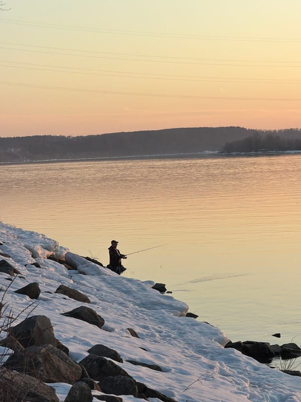 Winter sunset fishing scenes documented along Kama River, Russia
