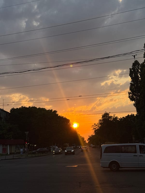 Golden sunset over Odesa, clouds lit in orange and pink