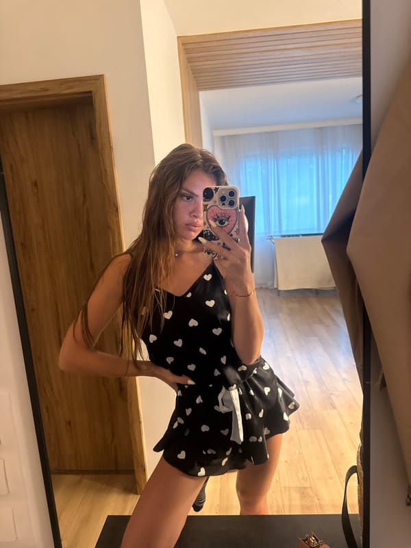 Mirror selfies in black heart-print outfit, Plovdiv apartment