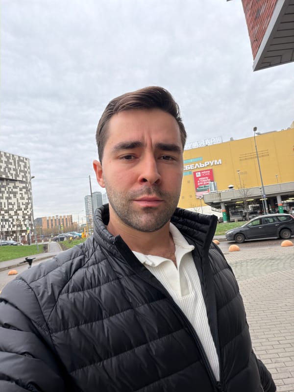 Man takes selfie on Moscow street near commercial building