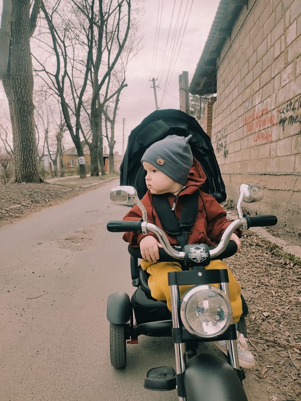 Father and toddler enjoy outdoor time in Donetsk