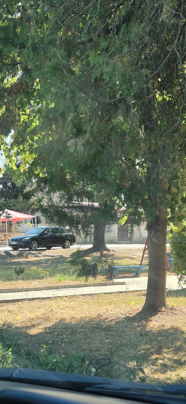 In-car drive through rural Bulgarian roads and neighborhoods