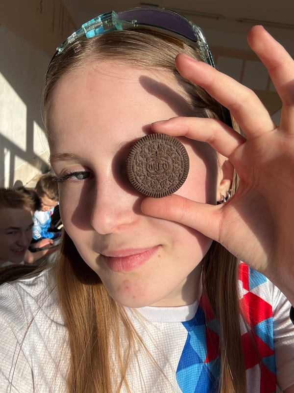 Person playfully poses with Oreo cookie in Yuzhnyy, Russia