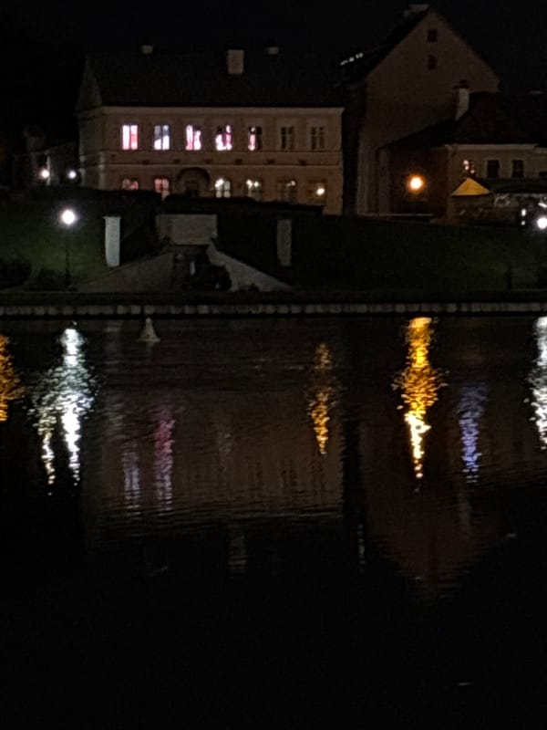 Nighttime photography session captures illuminated Minsk waterfront district
