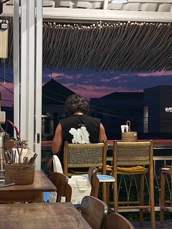 Social gathering at illuminated outdoor venue in North Kuta