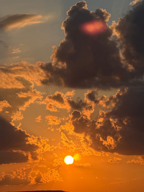 Dramatic Sunset Over Rolling Hills Witnessed by Multiple Observers