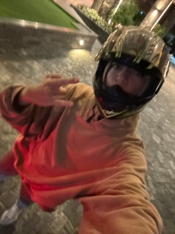 Person poses for photo near hotel entrance in Đà Nẵng
