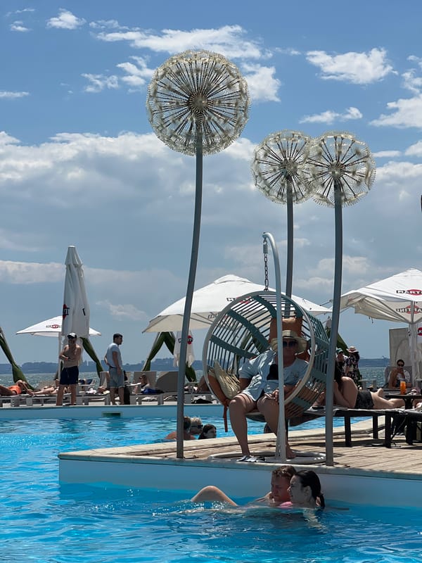 Sunny afternoon at a Fontanka beach club pool