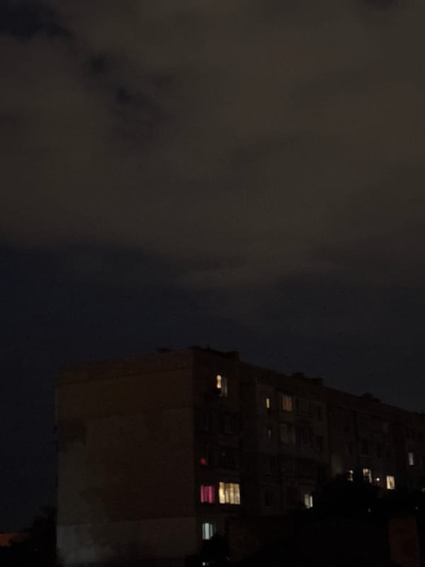 Brutalist apartment block at night in residential Sofia