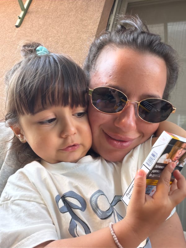 Mother and child share afternoon playtime in Burgas courtyard