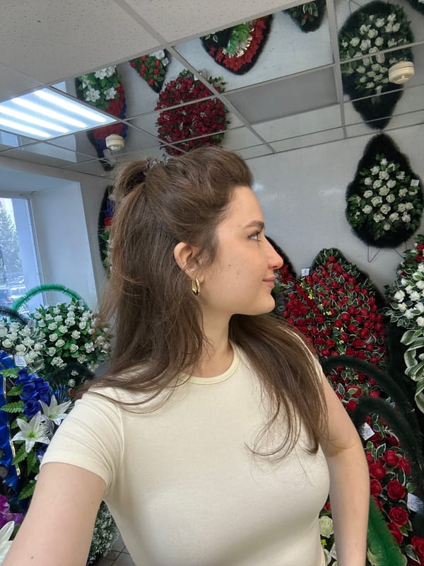 Woman documents genealogy research visit in Ufa shop