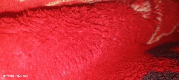 Close-up of red textured fabric photographed in Libya