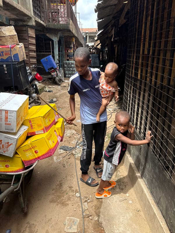 Street barber, daily life documented in Onitsha, Nigeria