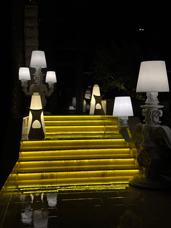 Night scenes captured across wet Budva streets and establishments