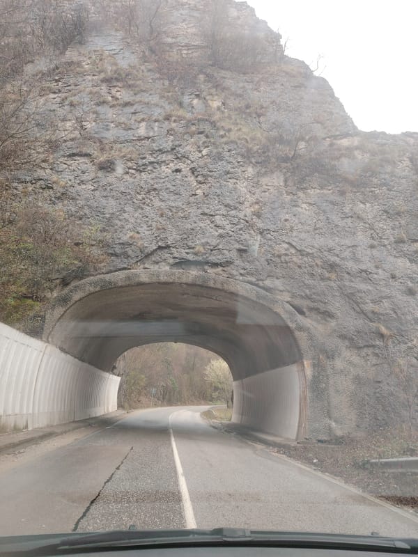 Vehicle passes through rock tunnel in Lyutibrod, Bulgaria