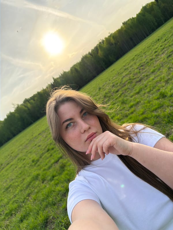 Woman photographed in field near Zlodar', Russia