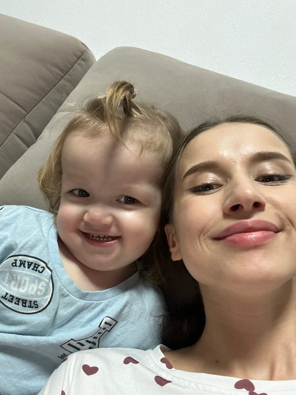 Mother and child share quiet moment on couch in Yekaterinburg
