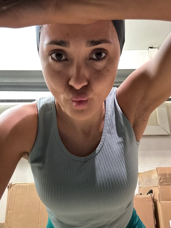 Woman photographed in Luxembourg dressing room with French boxes