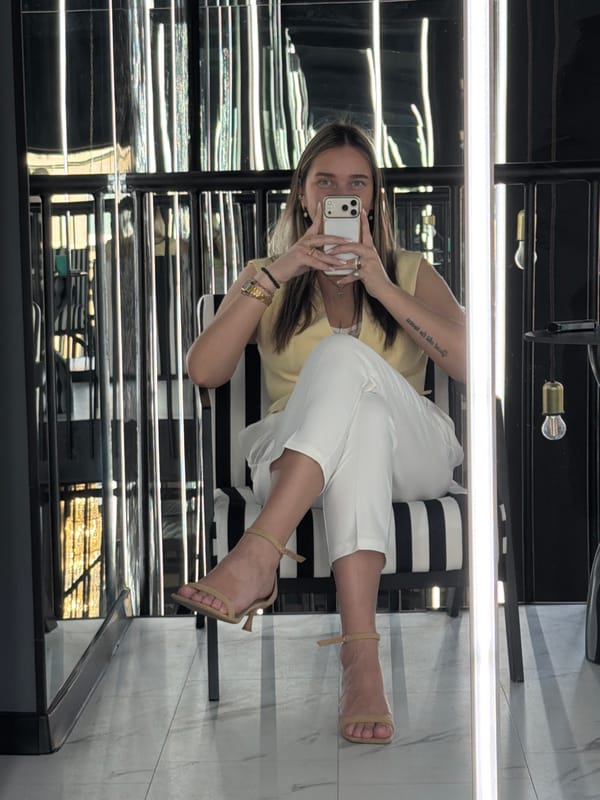 Woman takes morning selfies in yellow blazer, Moscow