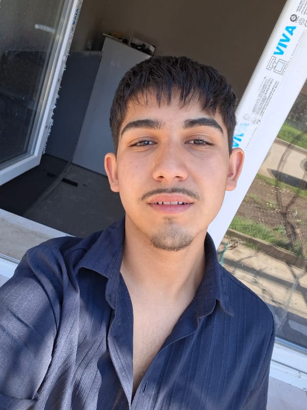 Young man takes selfie video outside business in Bulgaria
