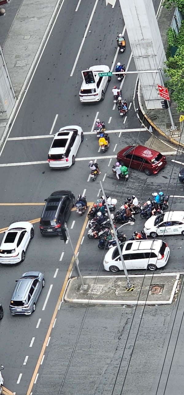 Morning traffic and street activity across Makati City
