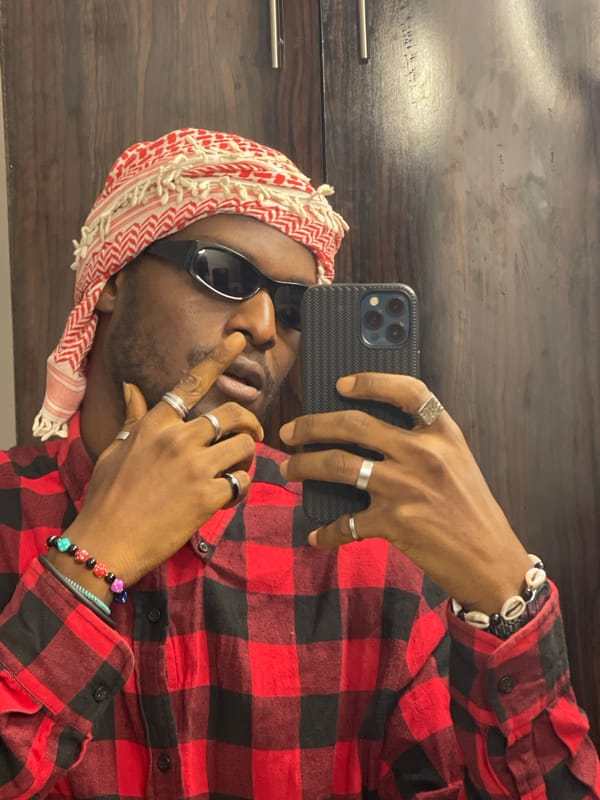 Quick selfie session in Abuja, consistent outfit, indoor setting.