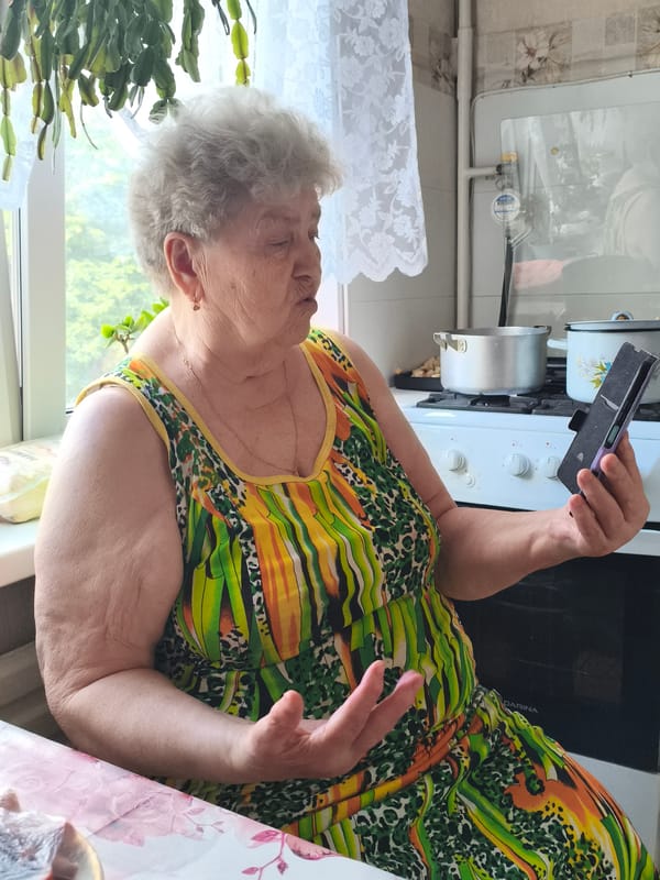 Two women photographed in Izhevsk kitchens within minutes