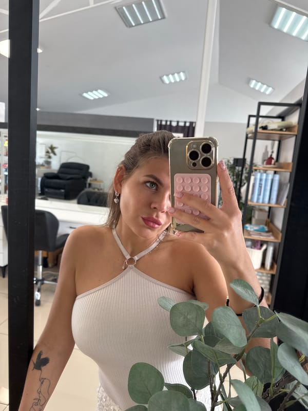 Mirror selfie session at a Chaikovsky salon, July 2026
