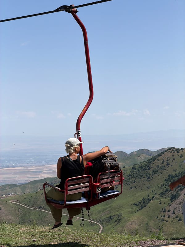 Vintage chairlift running through Kyrgyzstan's green mountain slopes