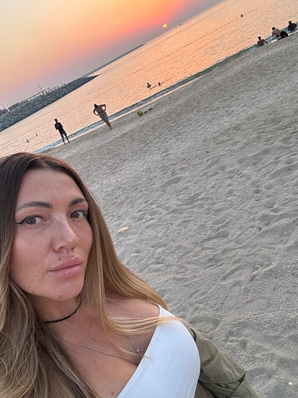 Woman captures sunset selfie at Dubai beach