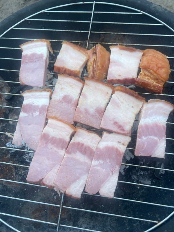Backyard barbecue with grilled bacon and casual moments