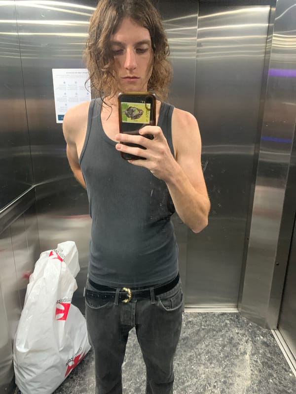 Person documents evening routine in Buenos Aires elevator, bathroom