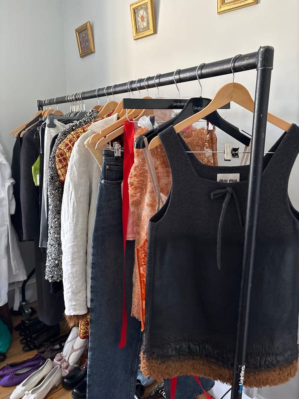 London OOTD prep: clothing rack and hashtag graphic