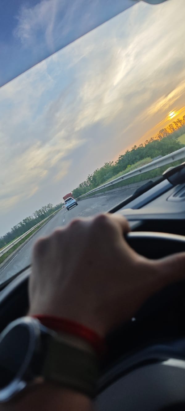 Driver travels highway near Tikhoretsk with navigation active