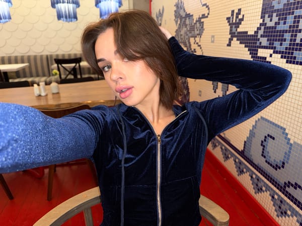 Woman documents cafe visit with selfies in Perm