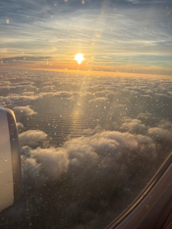 Passenger photographs sunset clouds from airplane over Portugal