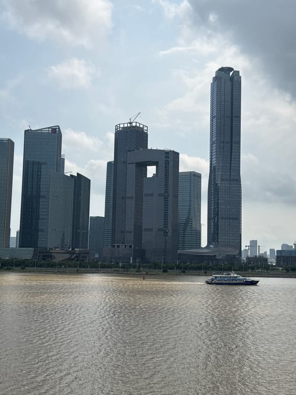 Morning views document Macao waterfront skyline construction activity